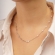 Ατσάλινο κοντό κολιέ Excite Fashion Jewellery  με συνδυασμό ασημί αλυσίδας με οβάλ στοιχεία και ροζάριο με μπεζ χάντρες.  K-1509-03-31-55