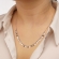 Επιπλατινωμένο κοντό κολιέ Excite fashion Jewellery  με αλυσίδα και κρεμαστά φλουράκια από ανοξείδωτο ατσάλι.  N-79-70S