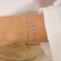 Βραχιόλι  Excite Fashion Jewellery dots με λευκά ζιργκόν από επιχρυσωμένο ασήμι 925. B-33-AS-G-6