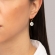 Σκουλαρίκια Excite Fashion Jewellery, κρίκοι από επίχρυσο ατσάλι με κρεμαστό λευκό ματάκι μουράνο. S-1610-01-17-45
